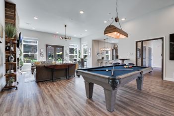 Community room with pool table, fireplace & lounge